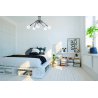 Sypialnia w stylu loft z lampą sufitową