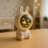 Lampka dziecięca nocna projektor gwiazd grający przenośny KOSMONAUTA